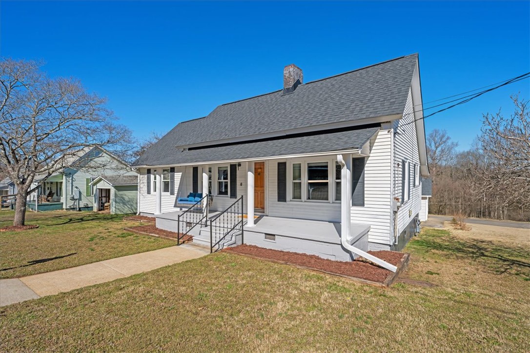 6 Fuller Street Pelzer, SC 29669 - Photo 3 of 36 A charming home featuring a welcoming front porch and classic architectural details.