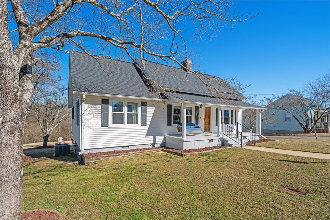 6 Fuller Street Pelzer, SC 29669 - Photo 4 of 36 Charming home with classic architecture and welcoming front porch.