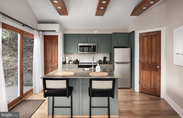 a kitchen with a table and chairs in it