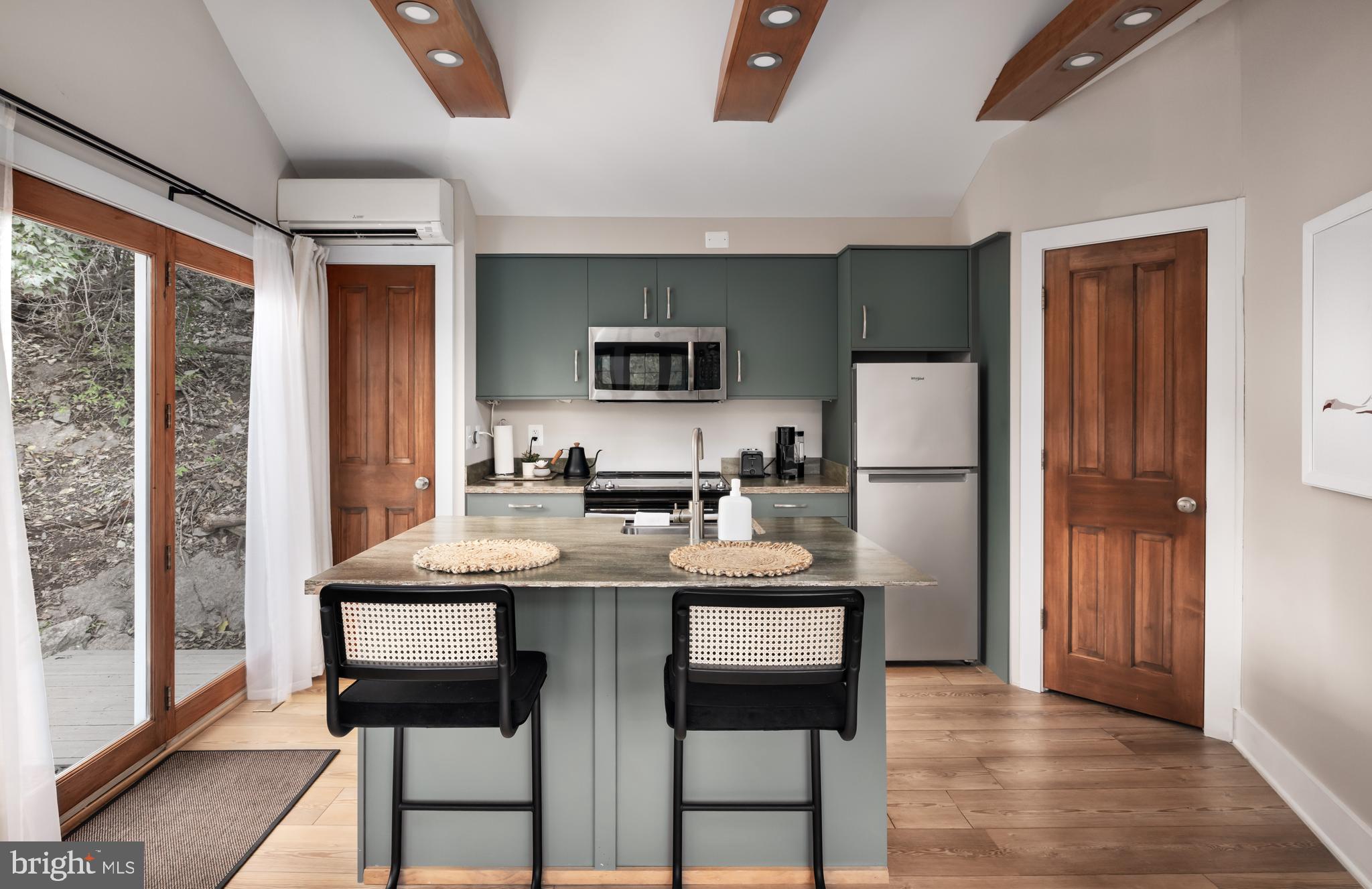 730 Bennys Beach Road Front Royal, VA 22630 - Photo 15 of 44 a kitchen with a table and chairs in it