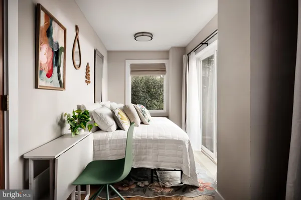 a bedroom with a bed and lamp