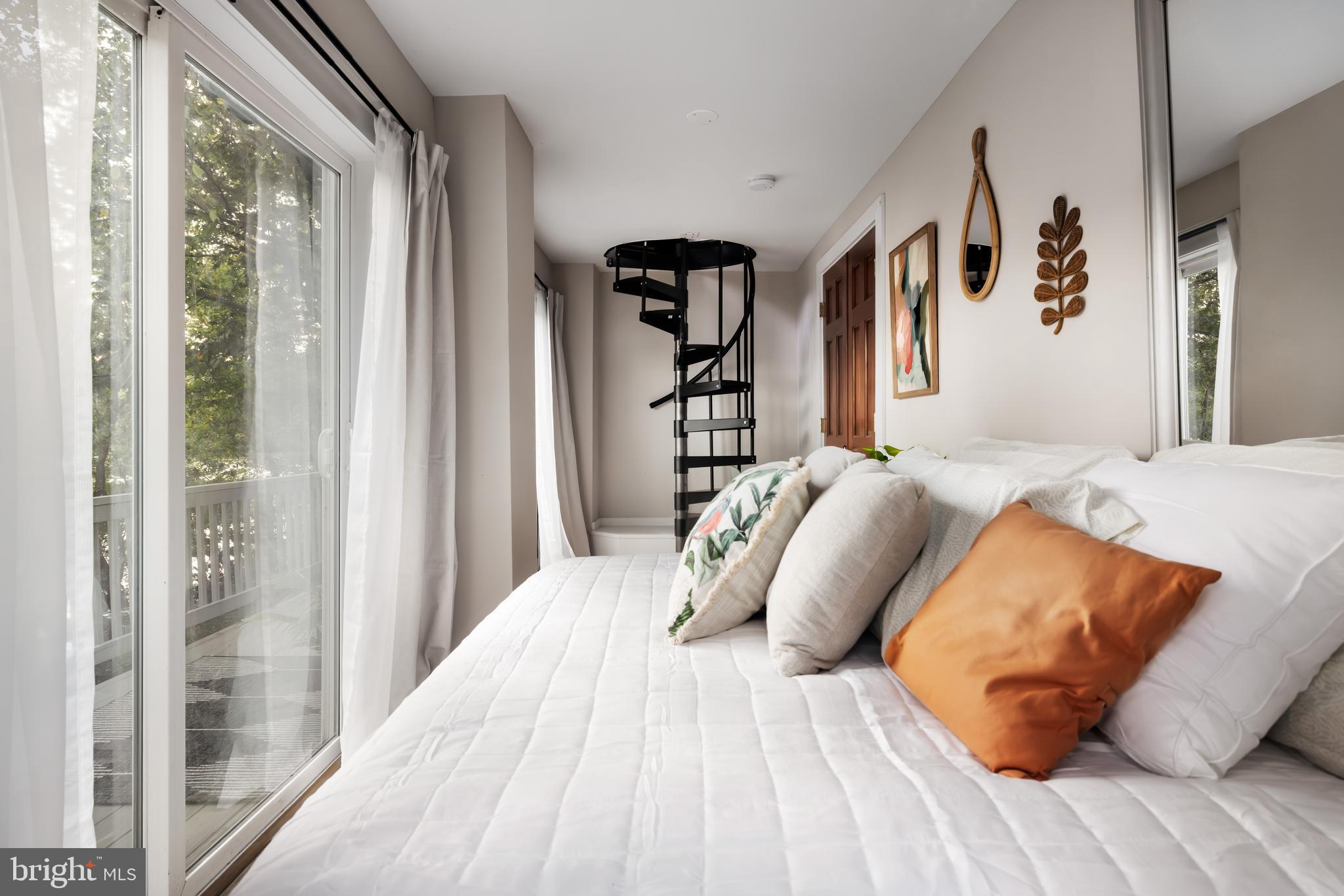 730 Bennys Beach Road Front Royal, VA 22630 - Photo 27 of 44 a bedroom with a bed and lamp