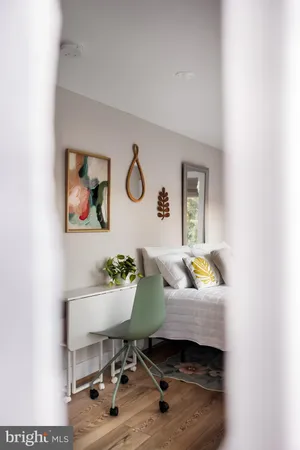 a view of a living room with a floor to ceiling window and floor to ceiling window