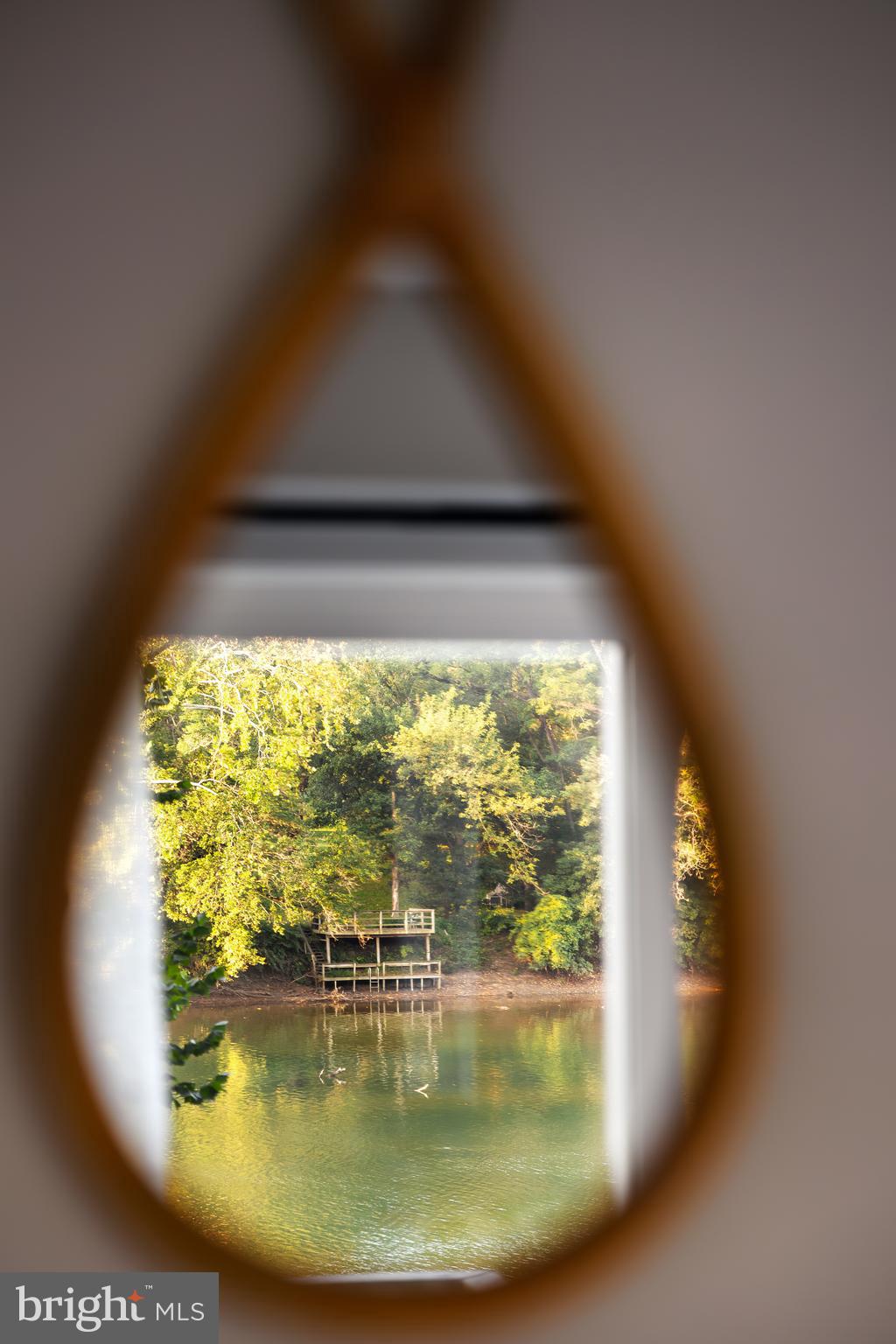 730 Bennys Beach Road Front Royal, VA 22630 - Photo 31 of 44 a view of a living room with a floor to ceiling window and floor to ceiling window