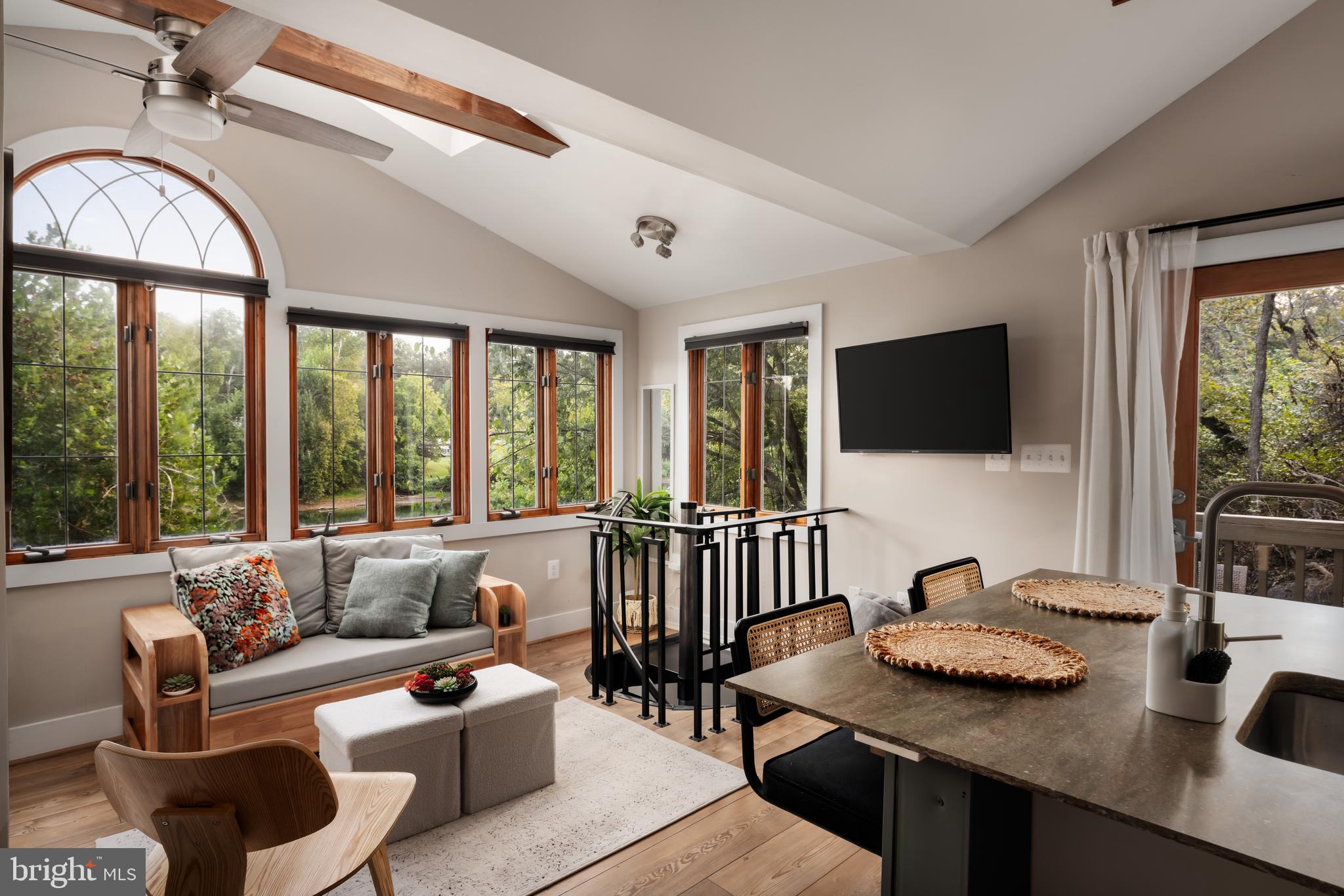 730 Bennys Beach Road Front Royal, VA 22630 - Photo 6 of 44 a living room with furniture a flat screen tv and a large window