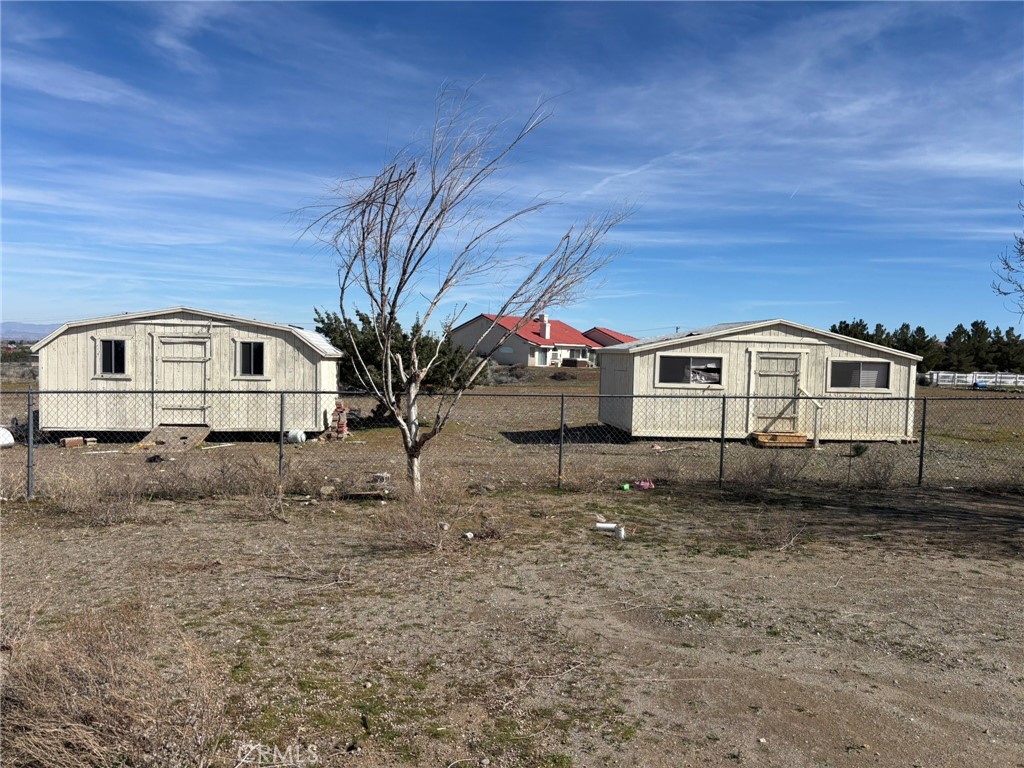 9591 Colfax Road Phelan, CA 92371 - Photo 18 of 24 2 STORAGES IN BACK YARD