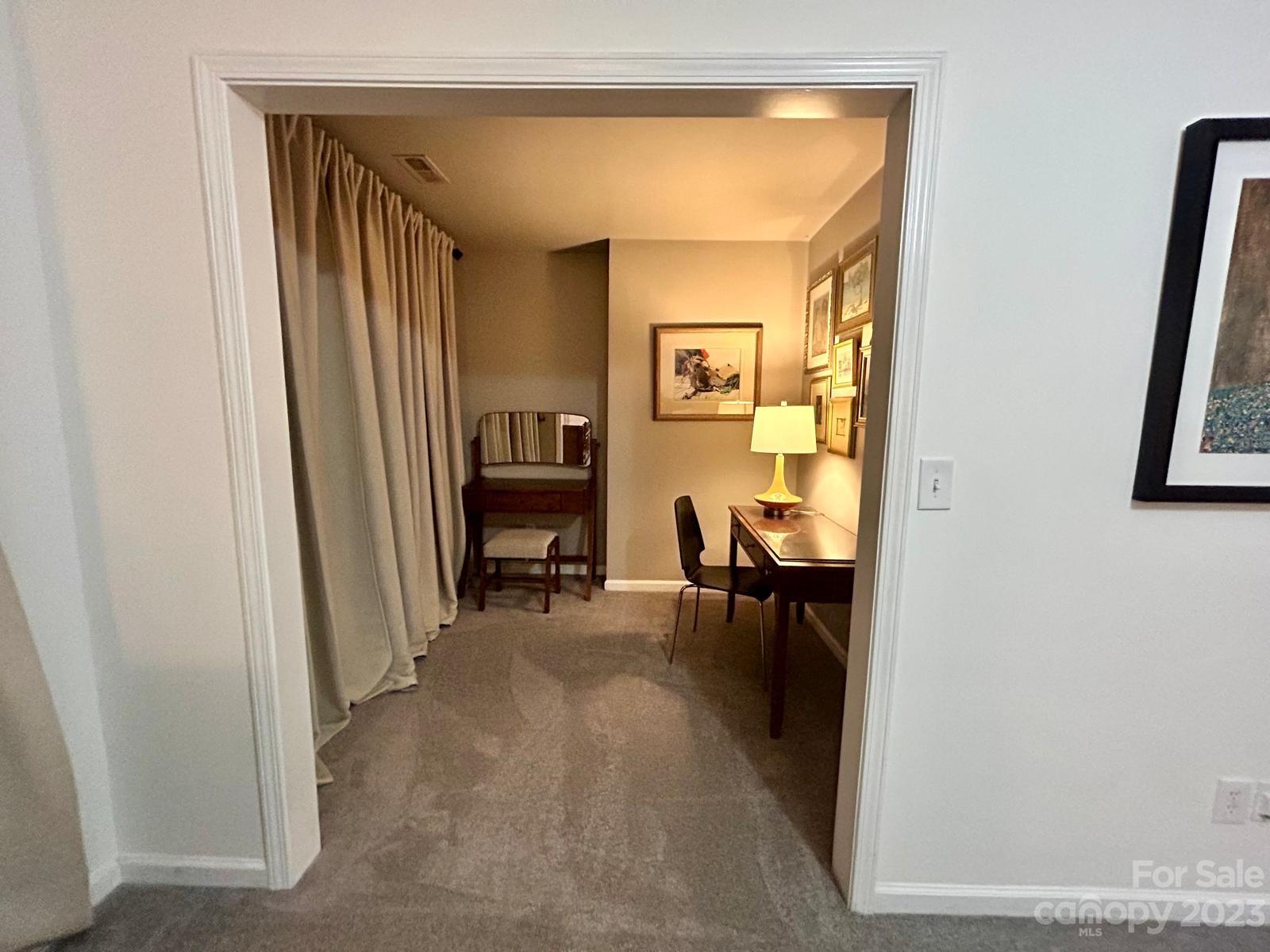9724 Steele Meadow Road Charlotte, NC 28273 - Photo 12 of 21 a view of a hallway to a livingroom with furniture and a window