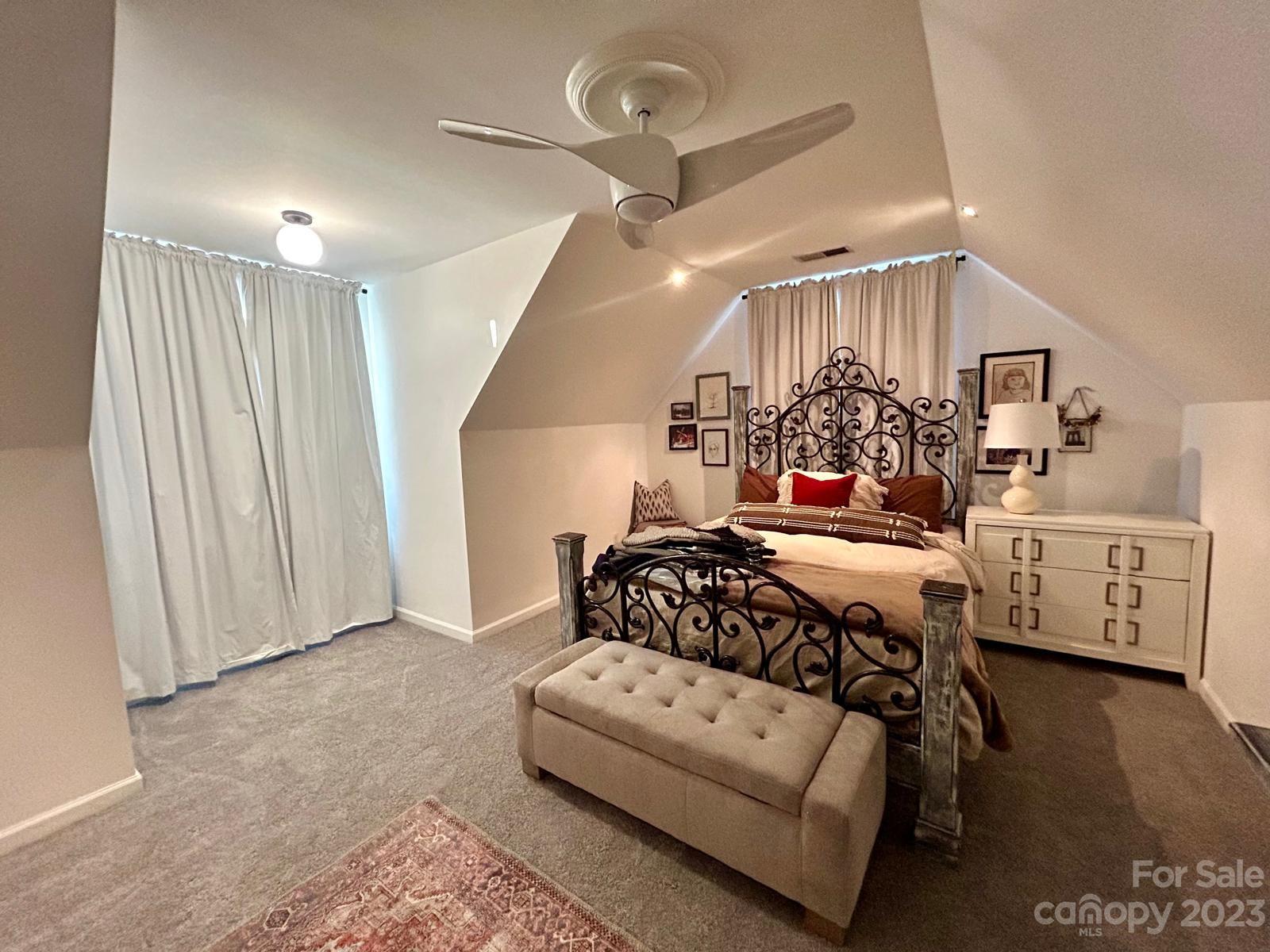 9724 Steele Meadow Road Charlotte, NC 28273 - Photo 15 of 21 a bedroom with furniture and a chandelier
