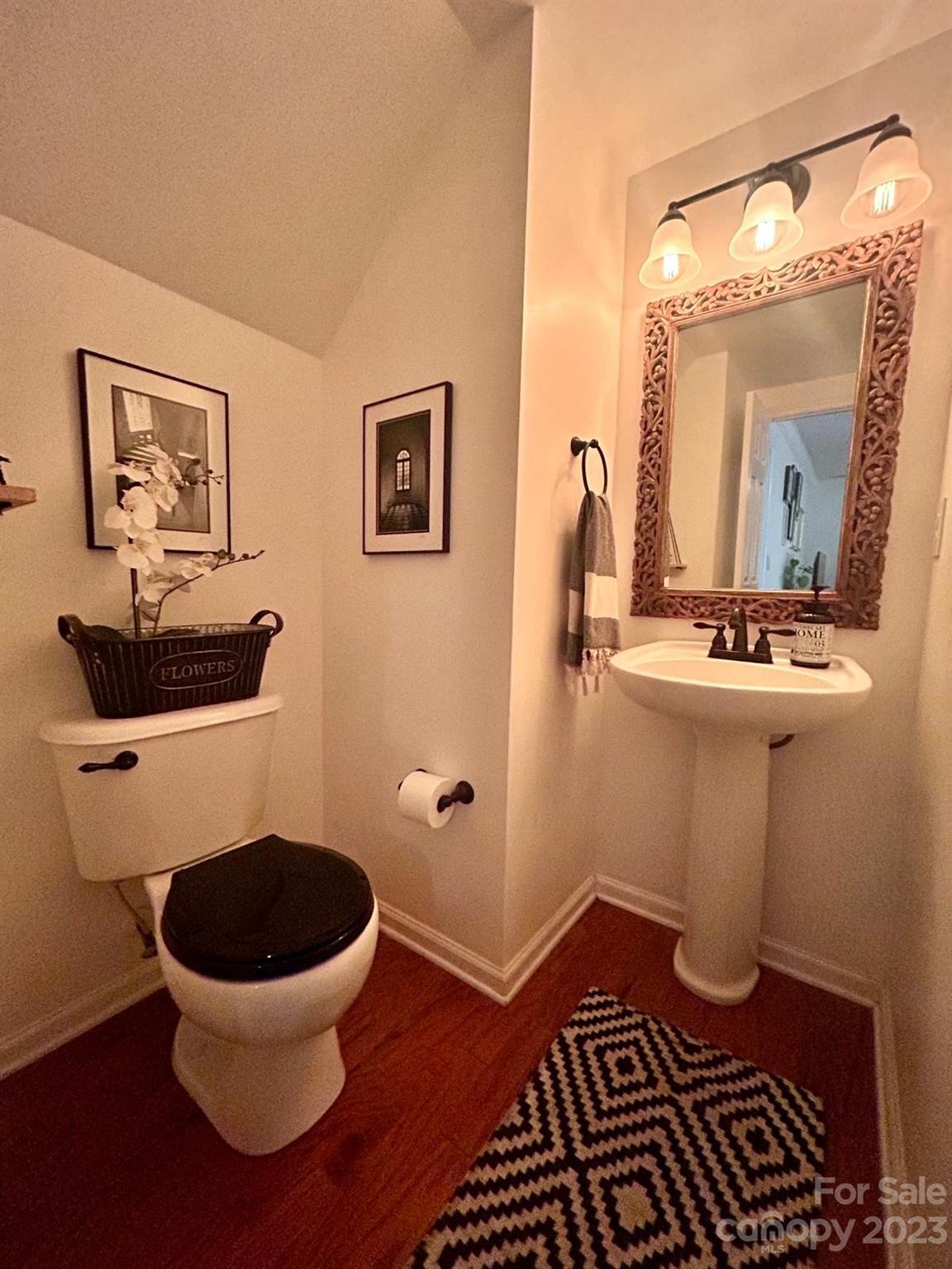 9724 Steele Meadow Road Charlotte, NC 28273 - Photo 17 of 21 a bathroom with a toilet and a mirror