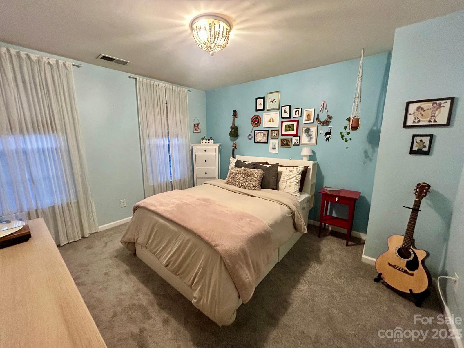 9724 Steele Meadow Road Charlotte, NC 28273 - Photo 18 of 21 a bedroom with a bed and a large mirror on the dresser