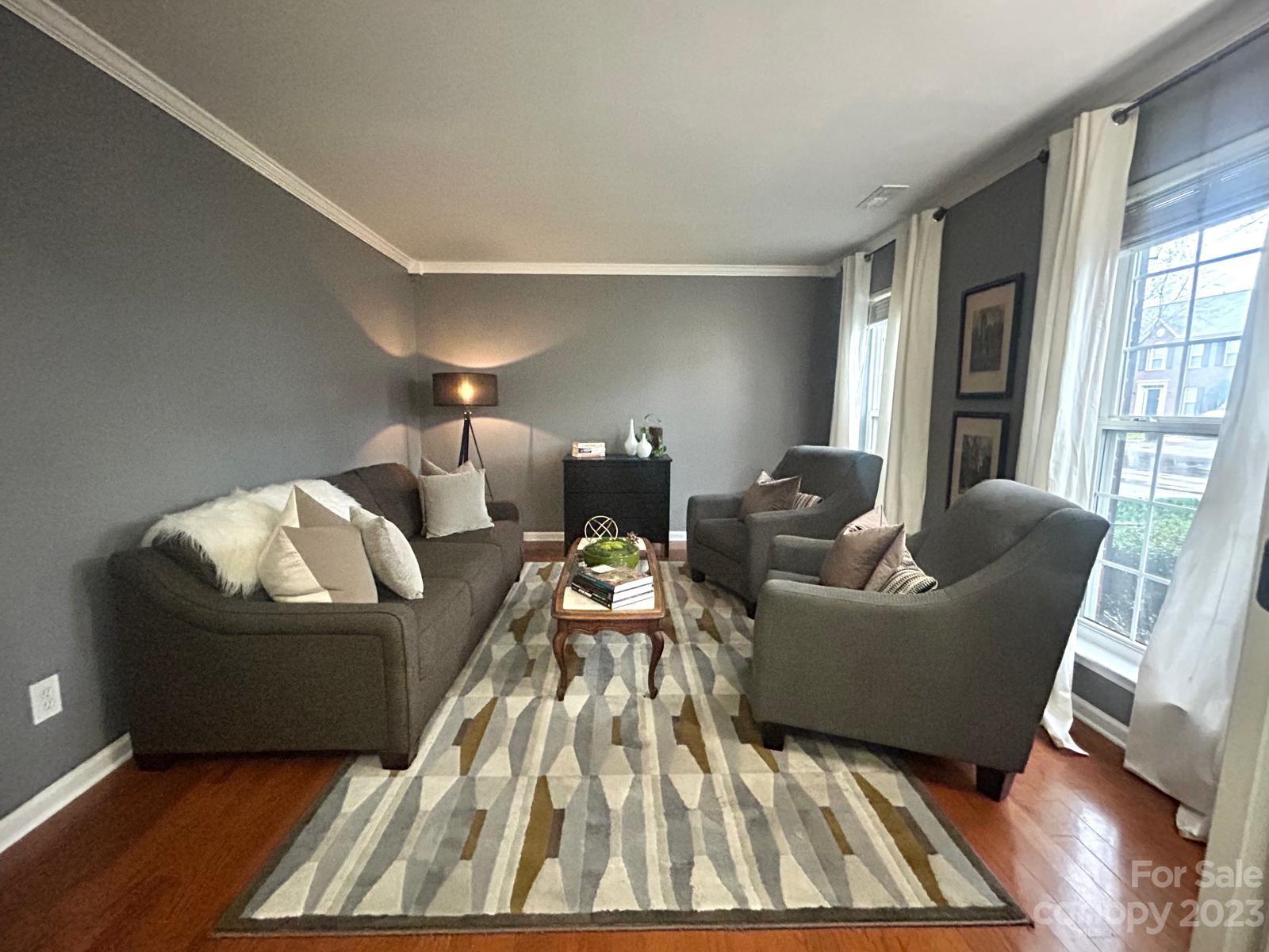 9724 Steele Meadow Road Charlotte, NC 28273 - Photo 5 of 21 a living room with furniture and a rug