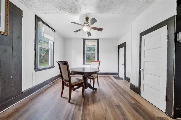 a dining room with furniture window wooden floor