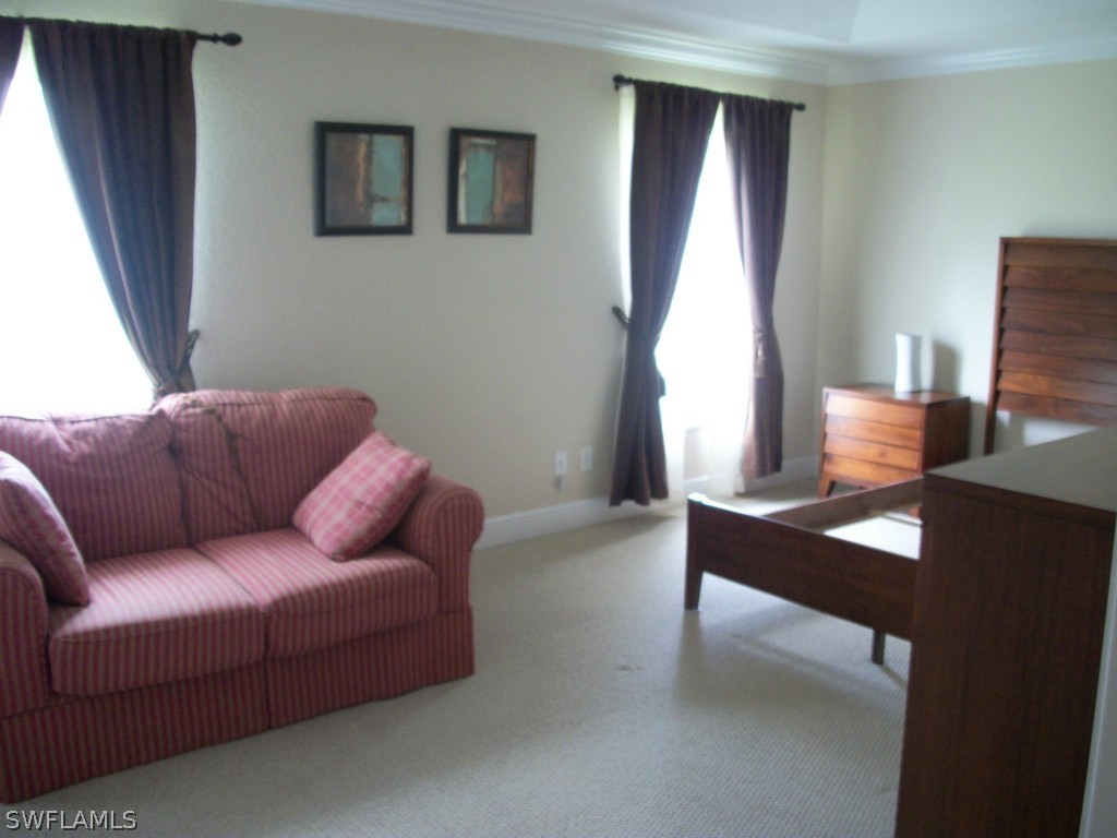 1019 Caribbean Avenue Clewiston, FL 33440 - Photo 11 of 16 a living room with furniture and a window