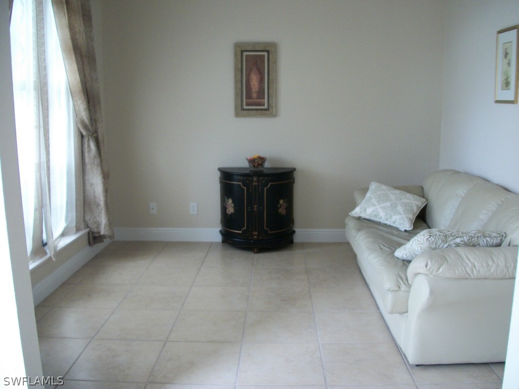 1019 Caribbean Avenue Clewiston, FL 33440 - Photo 5 of 16 a living room with furniture and a window