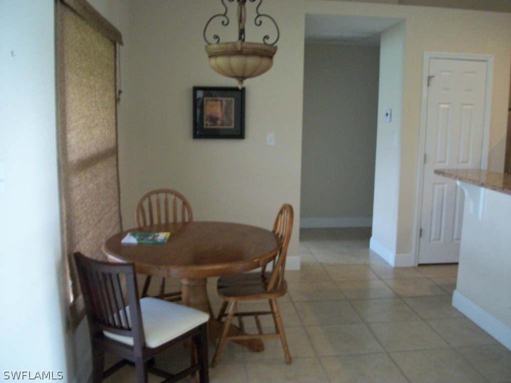 1019 Caribbean Avenue Clewiston, FL 33440 - Photo 6 of 16 a view of a dining room with furniture