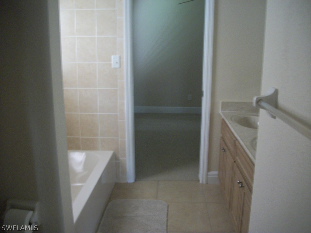 1019 Caribbean Avenue Clewiston, FL 33440 - Photo 8 of 16 a bathroom with a sink and shower