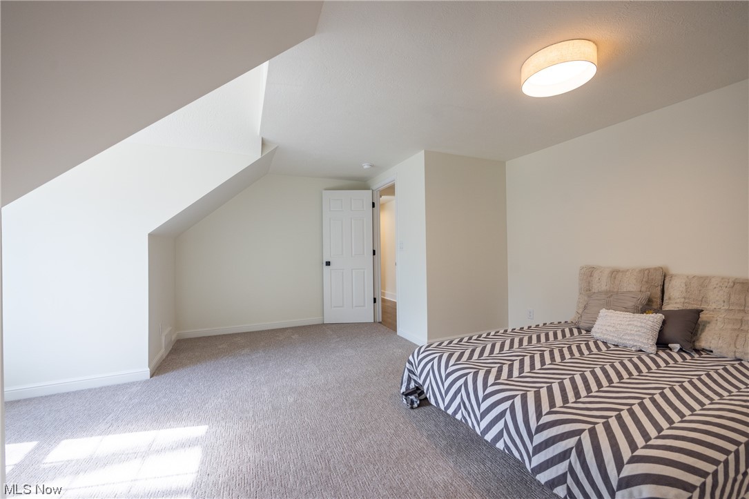 32887 Cedar Road Mayfield Heights, OH 44124 - Photo 17 of 44 Carpeted bedroom with lofted ceiling