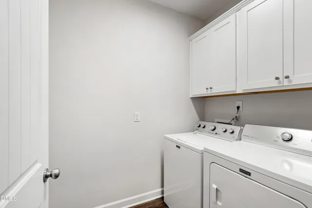 a bathroom with a sink a potted plant and a mirror