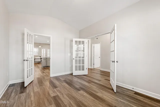 a bedroom with a large bed and a large window