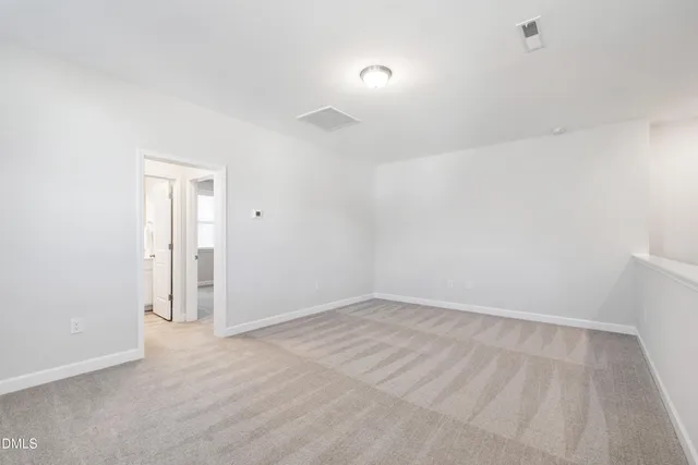 an aerial view of a house with outdoor space and street view