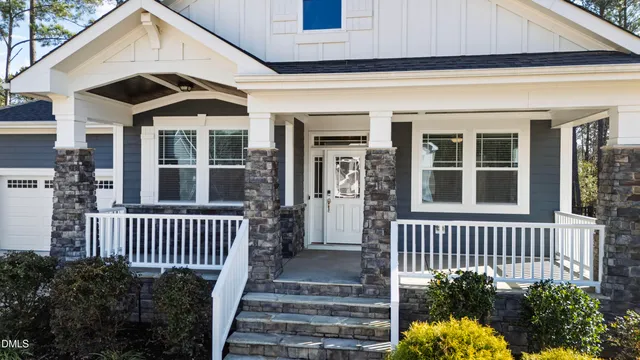 a view of a house with porch and wooden floor