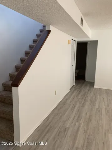 a view of a big room with wooden floor