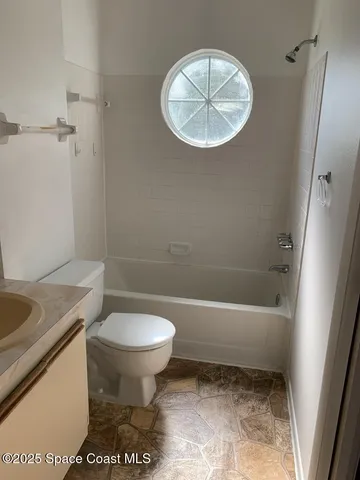 a bathroom with a sink a toilet and a bathtub