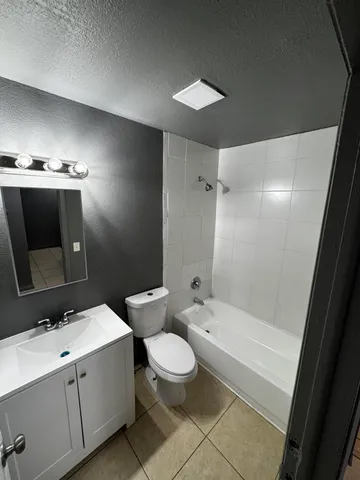 a bathroom with a toilet and a bathtub
