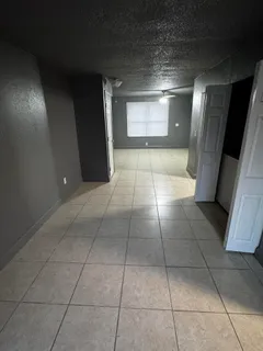 a view of a refrigerator in kitchen