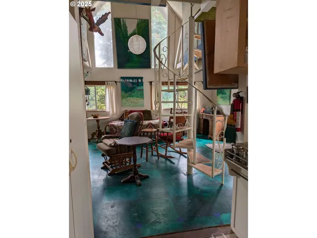 a view of a livingroom with furniture and windows