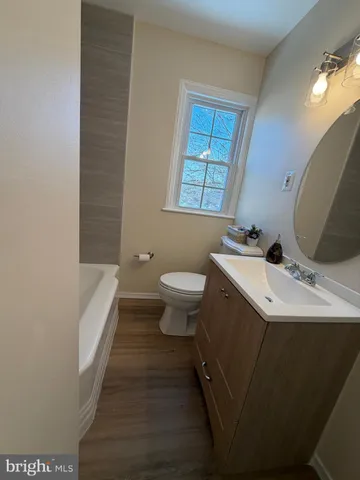a bathroom with a sink toilet and a bathtub