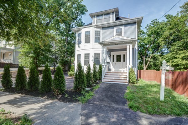 234 Langley Road Newton, MA 02459 - Photo 1 of 25 a front view of a house with garden