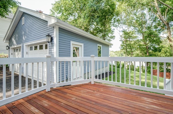 234 Langley Road Newton, MA 02459 - Photo 13 of 25 a view of a wooden deck and a yard