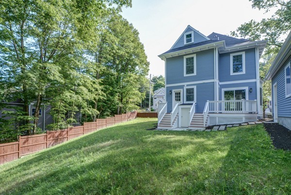 234 Langley Road Newton, MA 02459 - Photo 15 of 25 a view of a house with a yard and sitting area