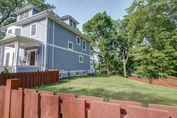 234 Langley Road Newton, MA 02459 - Photo 16 of 25 a front view of a house with a yard