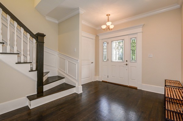234 Langley Road Newton, MA 02459 - Photo 4 of 25 a view of an entryway with wooden floor and door