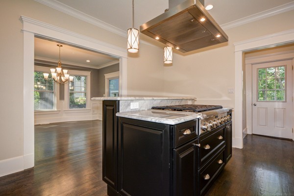 234 Langley Road Newton, MA 02459 - Photo 7 of 25 a kitchen with a stove and a wooden floors