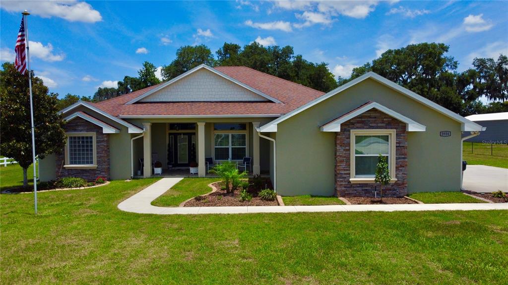 3934 Connersville Road Bartow, FL 33830 - Photo 65 of 81 a view of a house with a yard patio and a garden
