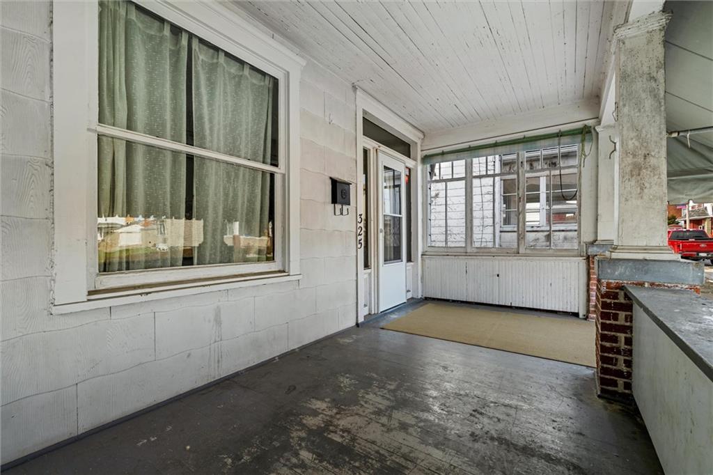 325 Walnut Street Vandergrift, PA 15690 - Photo 4 of 29 a view of an empty room with a window