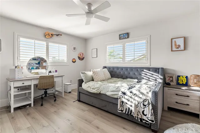 a bed room with furniture and a window