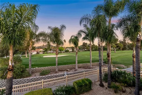 a view of swimming pool with outdoor seating and plants