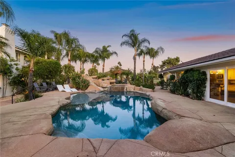 a view of a swimming pool with a patio