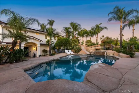 a view of a backyard of the house