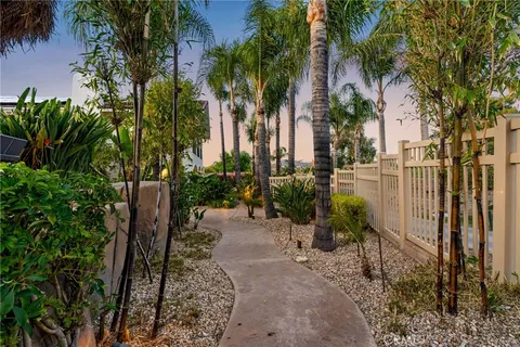 a kitchen with a sink stainless steel appliances and furniture