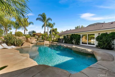 a room with gym equipment and a wooden floor