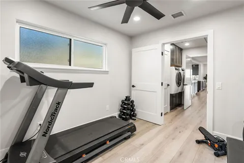 a living room with furniture kitchen area and a view
