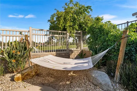 an aerial view of residential houses with outdoor space and swimming pool