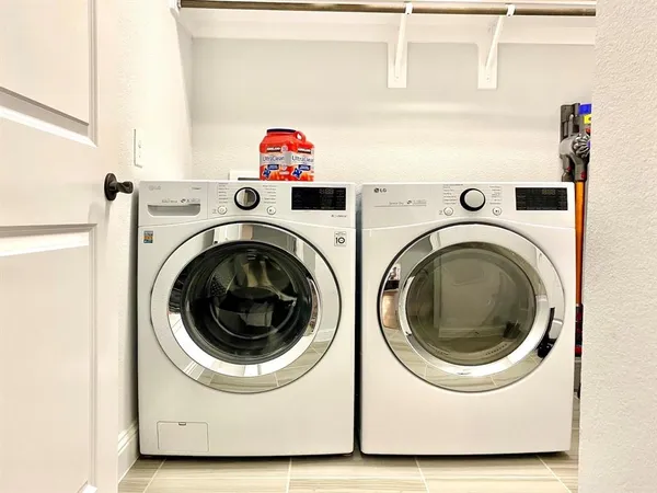 a utility room with dryer and washer