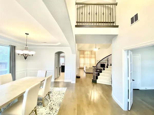 a view of a living room and kitchen with a sink