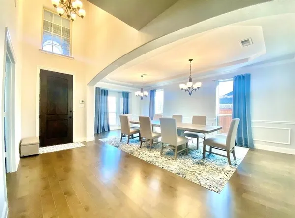 a view of a dining room with furniture window and wooden floor